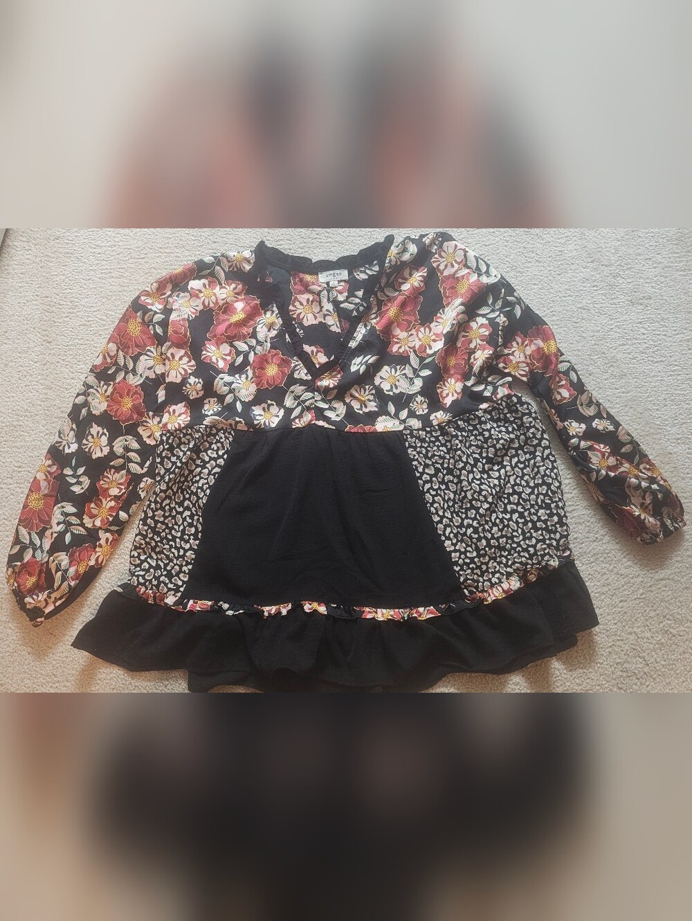 Umgee babydoll blouse features a bold, mixed design combining bohemian andanimal - Picture 6 of 10